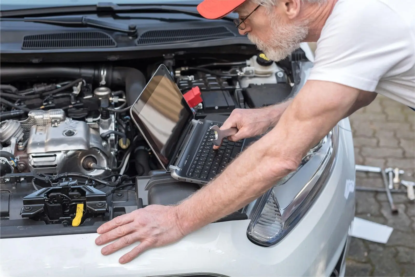 A technician inspecting a high-performance car part with precision measuring tools.